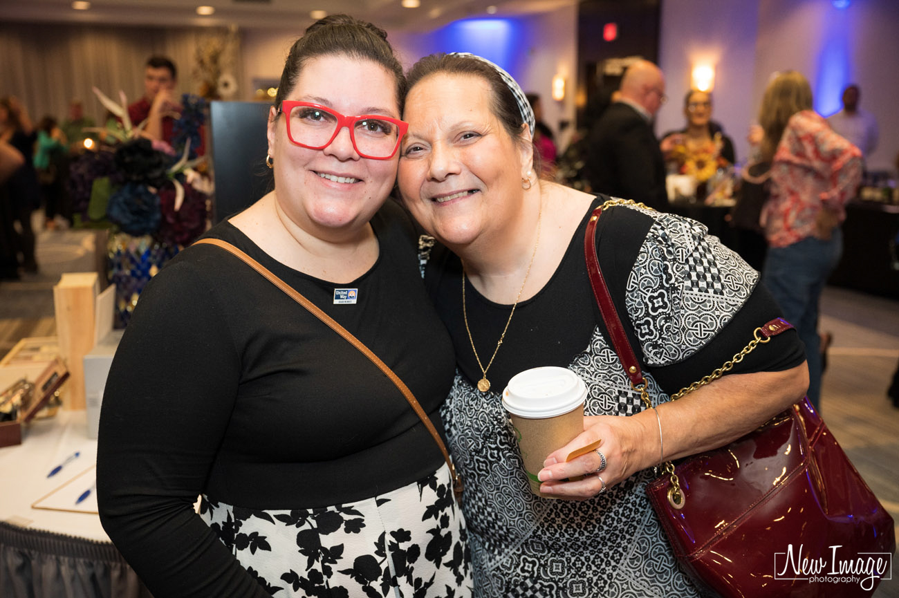 Two women posing for camera