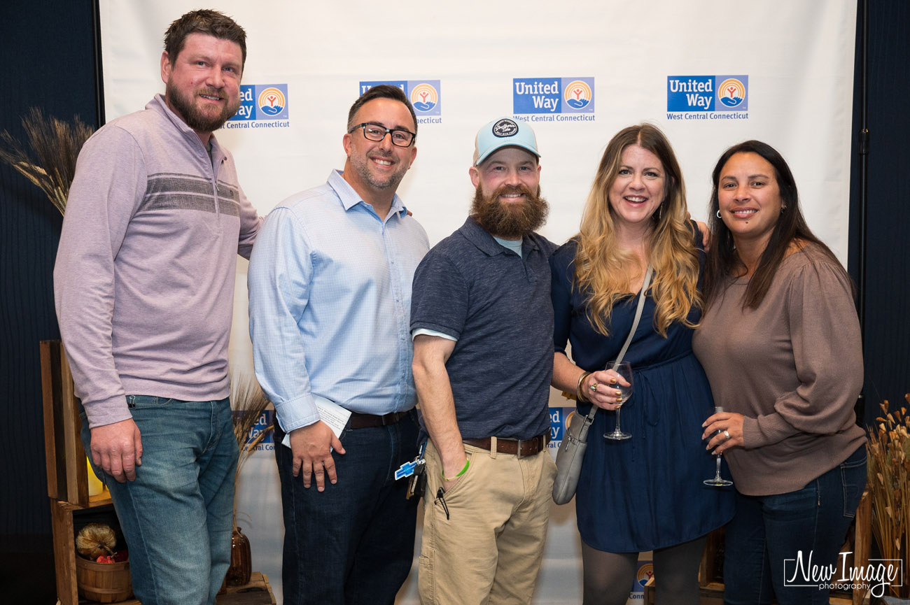 Group of adults posing for photo