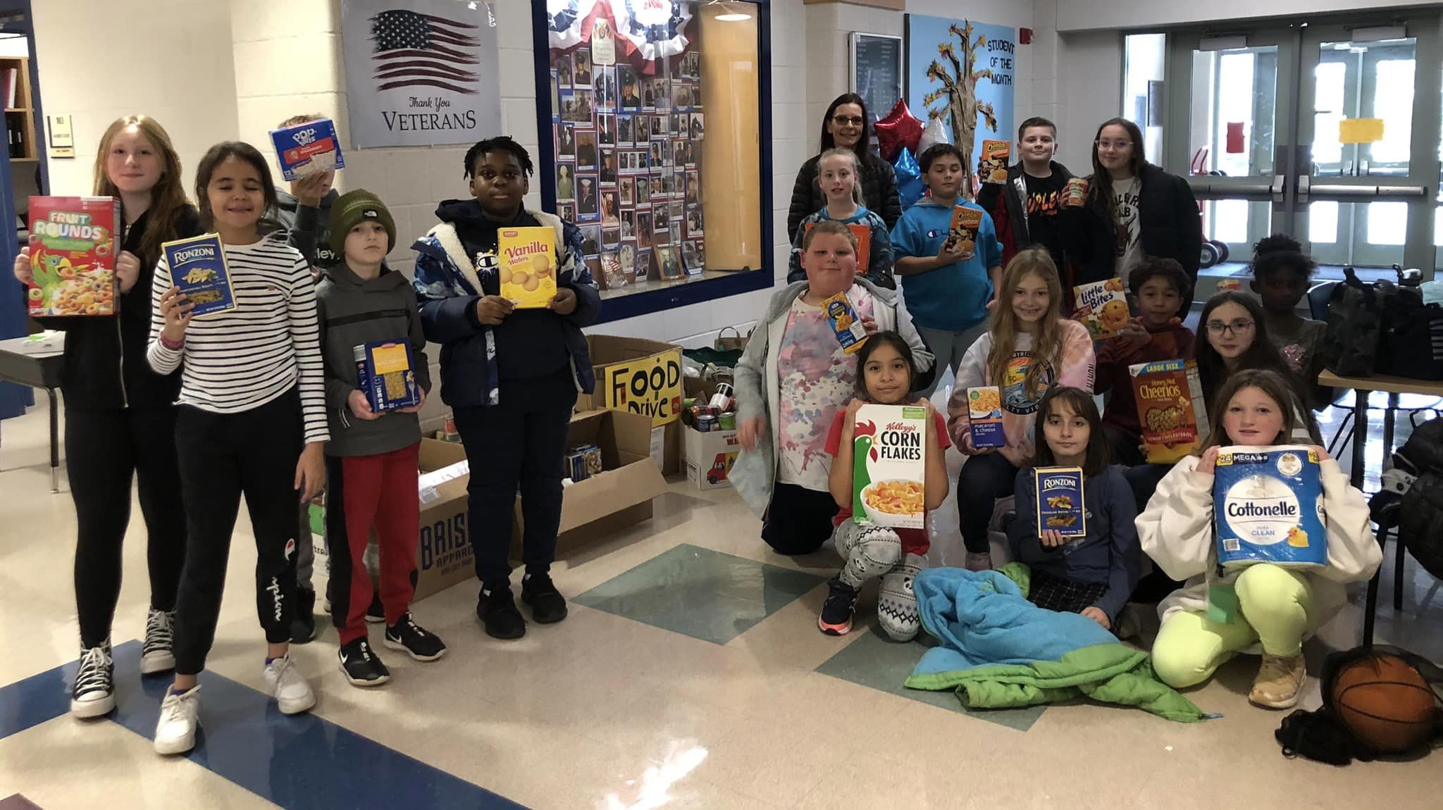 Group of elementary school students at a food donation drive