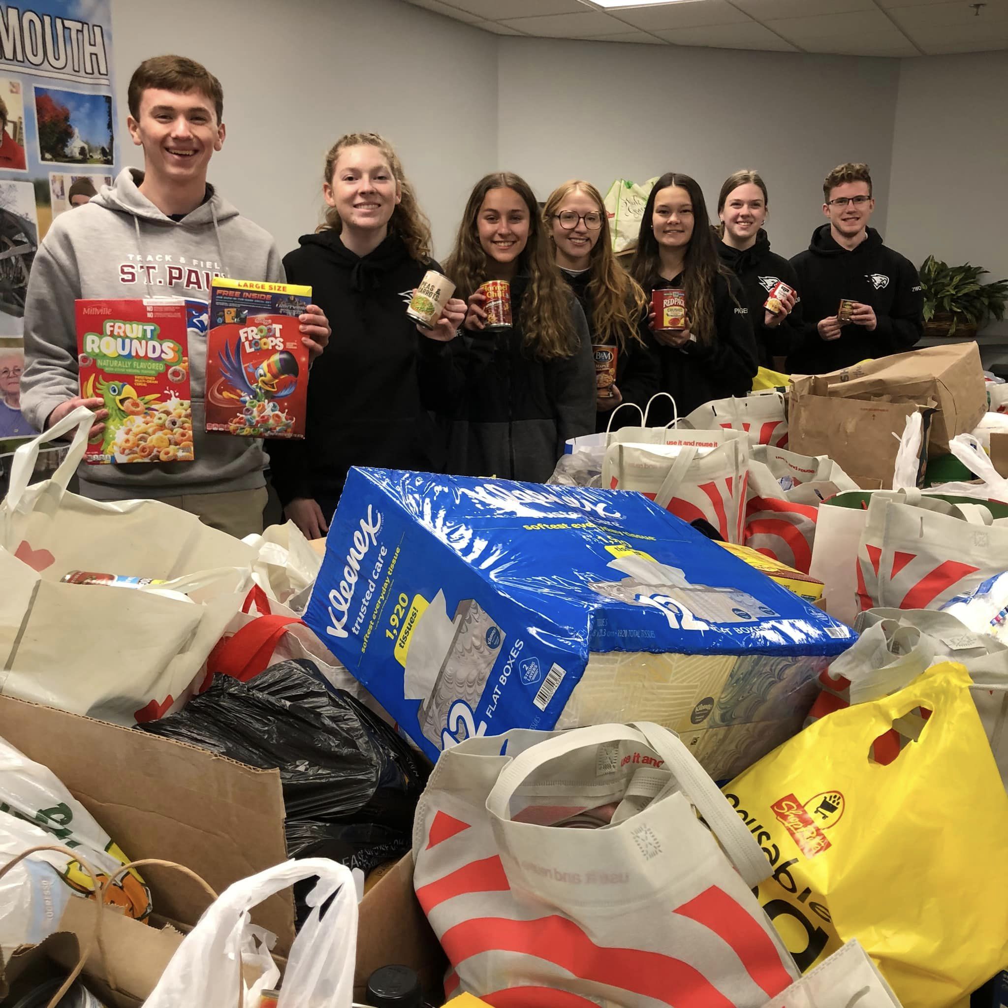 Group of high school students with nonperishable food donation