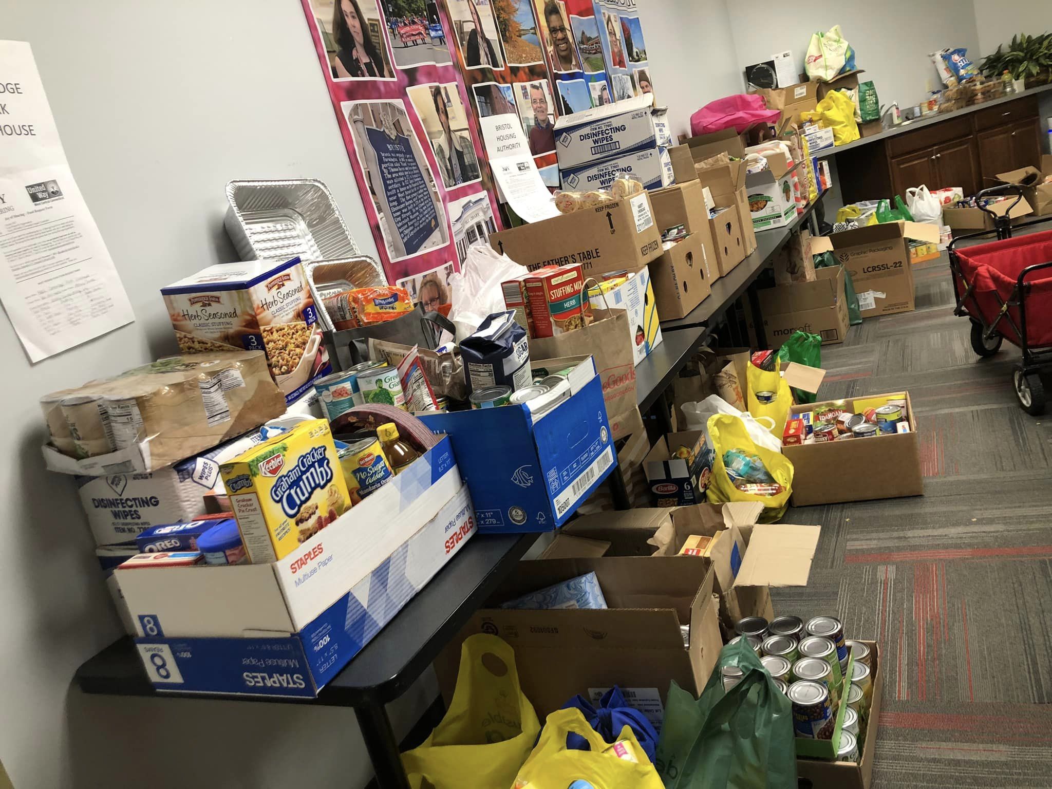 Room filled with nonperishable food donations on tables
