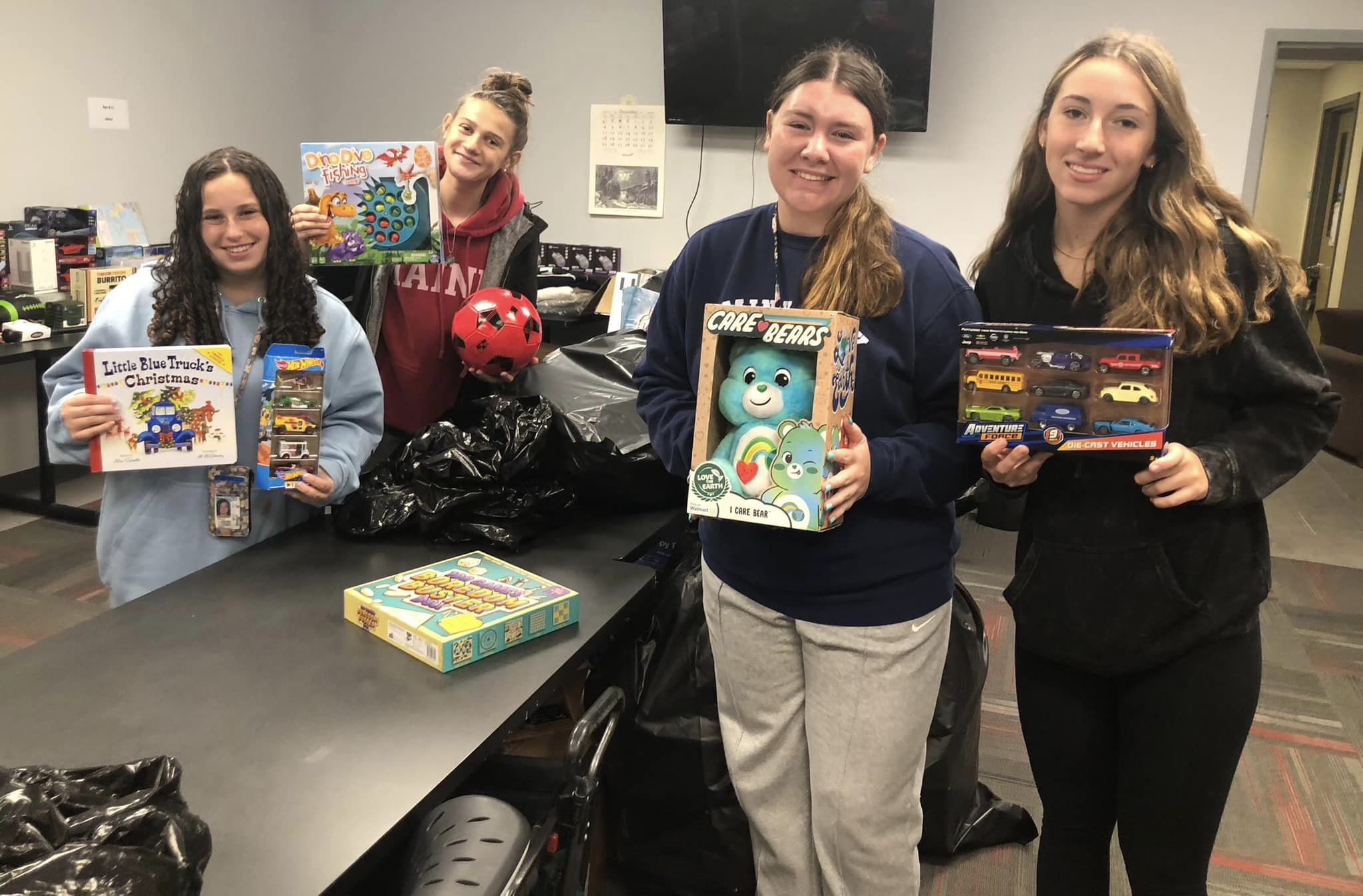 High school students making a toy donation