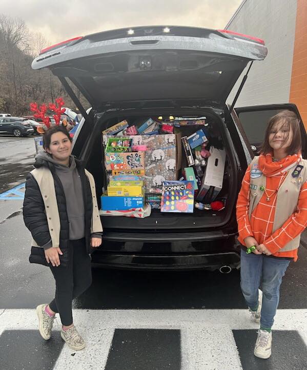 Back of a car filled with toy donations