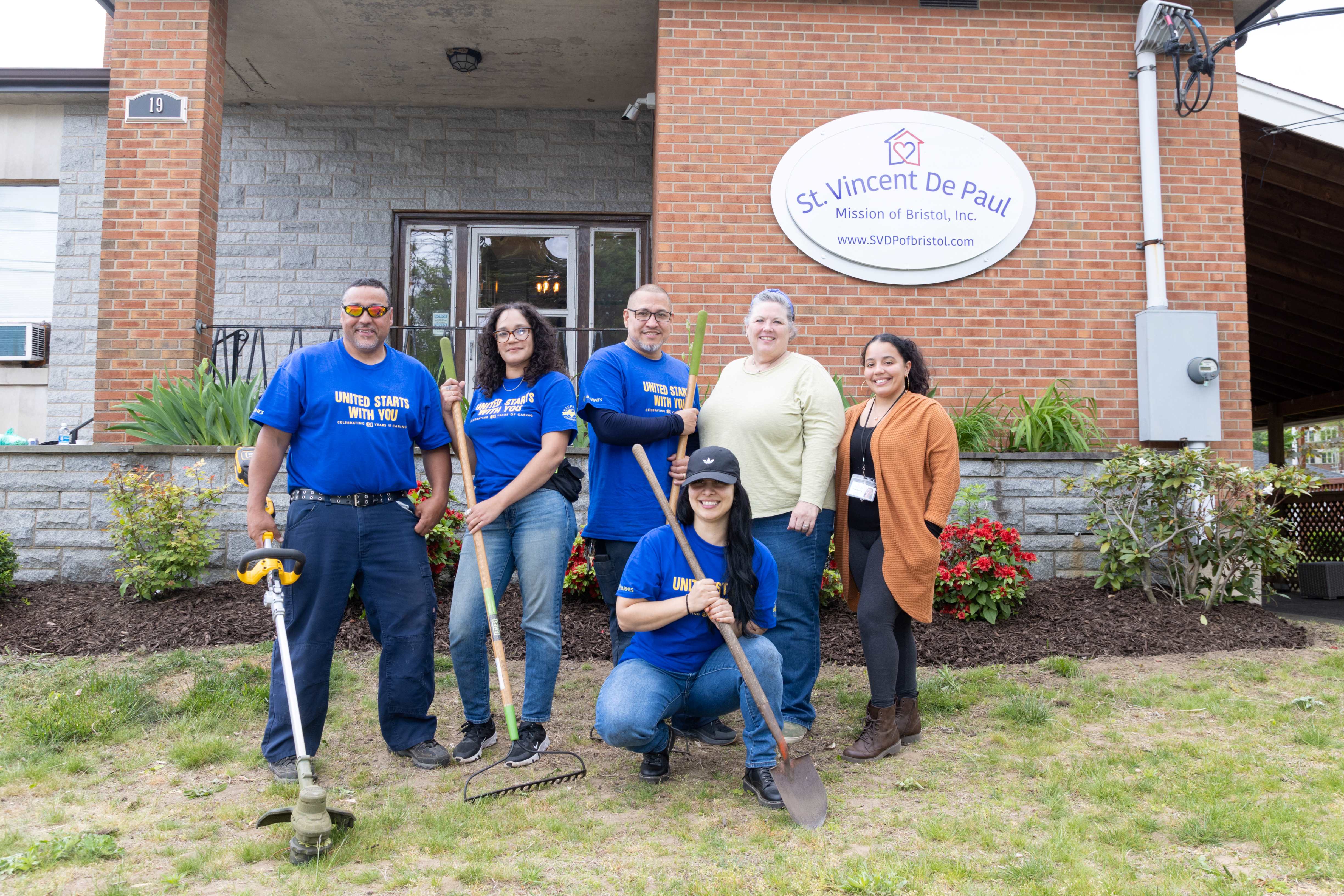 Group photo of Bristol Housing Authority volunteers at St. Vincent De Paul Mission.