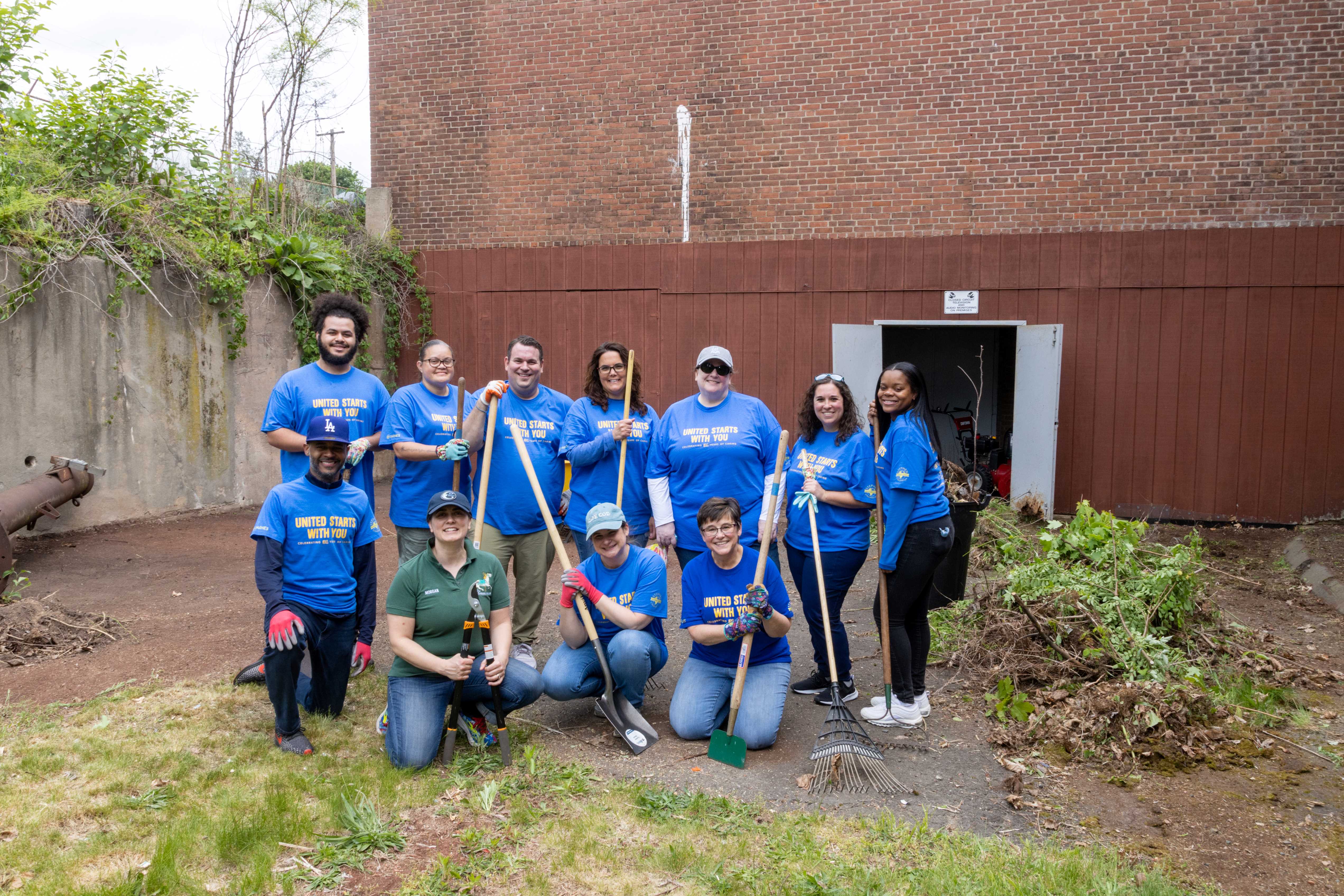 Group photo of Double Tree at Hilton volunteers at the Carousel Museum.